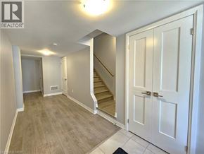 Cambridge townhouse for rent - A hallway with a staircase leading to the second floor.