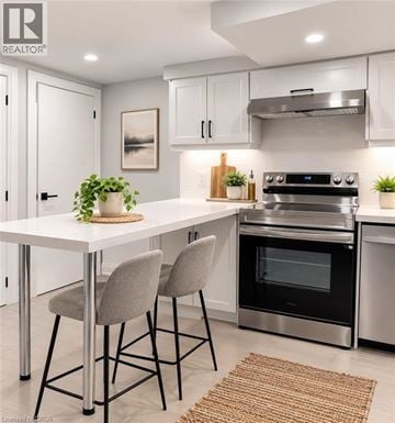 Hamilton apartment for rent - A modern kitchen with a white table and grey chairs.