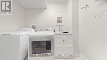 Mississauga (Meadowvale) apartment for rent - A white fridge and oven in a small kitchen.
