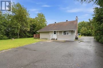 Ottawa apartment for rent - A house with a driveway in front of it is for sale.