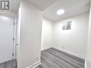 Markham (Unionville) condo for rent - A room with a door and a picture on the wall.