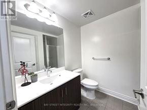 Markham (Unionville) condo for rent - A white sink and toilet in a small bathroom.
