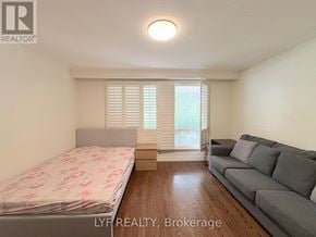 Markham (Unionville) apartment for rent - A bedroom with a bed and a couch in it.