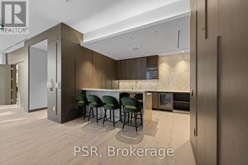 Toronto (Mount Pleasant West) condo for rent - A modern kitchen with a dining table and chairs.