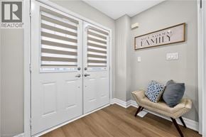 Caledonia apartment for rent - A room with a couch and a sign that says "NICE NORMAL FAMILY".