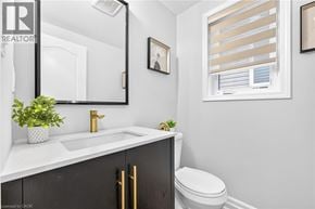 Caledonia apartment for rent - A bathroom with a white sink and black cabinetry.