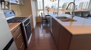 Richmond apartment for rent - A kitchen with a stove, oven, and sink.