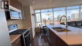 Richmond apartment for rent - A kitchen with a stove top oven and a microwave above it.