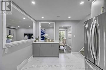 Hamilton (Corman) apartment for rent - A modern kitchen with a refrigerator on the right side.