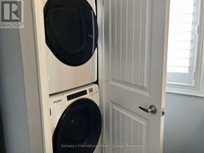 Collingwood townhouse for rent - A white washing machine and dryer in a small laundry room.