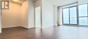 Toronto (Bayview Village) condo for rent - A room with a large window and sliding glass doors.