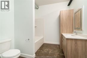 Chatham apartment for rent - A bathroom with a toilet, sink, and bathtub.