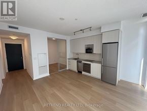 Toronto (Mount Pleasant West) condo for rent - A kitchen with a refrigerator, oven, and microwave.