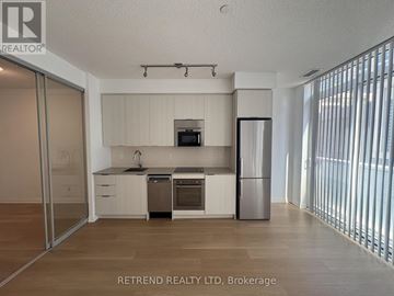 Toronto (Mount Pleasant West) condo for rent - A modern kitchen with white cabinets and stainless steel appliances.