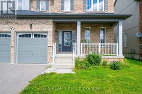 Brock (Sunderland) apartment for rent - A house with a grey garage door is for sale.