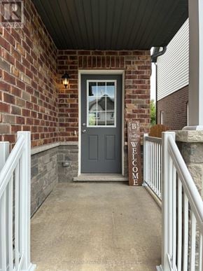 Woodstock (Woodstock - North) apartment for rent - A grey door with a glass window and a welcome sign on the porch.
