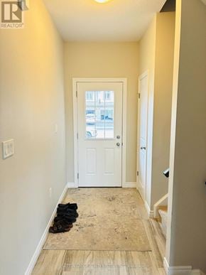 Woodstock (Woodstock - North) apartment for rent - A hallway with a door and a pair of shoes on the floor.