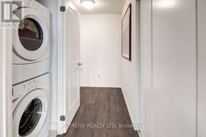 Toronto (Moss Park) condo for rent - A laundry room with a washer and dryer.