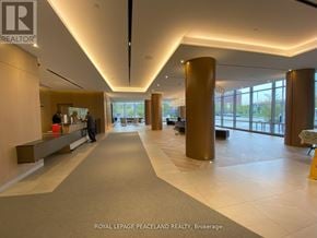 Toronto (Agincourt South-Malvern West) condo for rent - A spacious hallway with a few people walking through it.