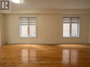 Markham (Cedarwood) apartment for rent - A room with wooden floors and two windows.