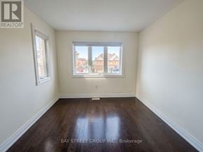 Markham (Cedarwood) apartment for rent - Empty room with a window and wooden flooring.