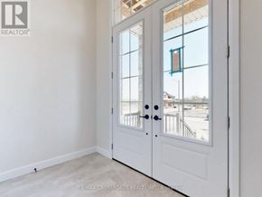 Peterborough (Monaghan Ward 2) apartment for rent - A white door with a glass window and a black handle.