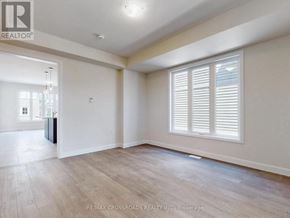 Peterborough (Monaghan Ward 2) apartment for rent - A spacious room with wooden flooring and white walls.