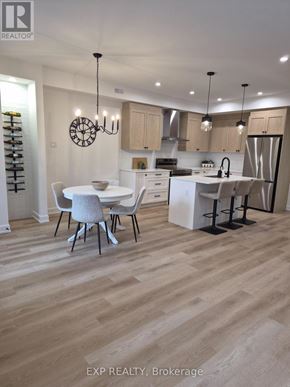 Ottawa multi-family for rent - A modern kitchen with a dining table and chairs.
