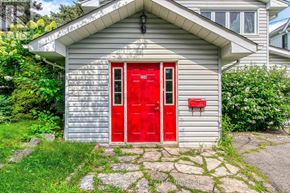 Oakville (Sw Southwest) apartment for rent - A small house with a red door and mailbox.