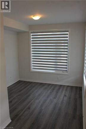 Cambridge townhouse for rent - A room with a window covered by white blinds.