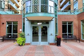 Toronto (Willowdale East) condo for rent - The front of a building with a blue door and windows.