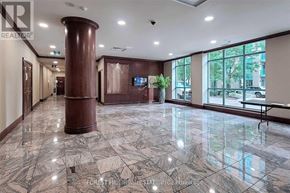 Toronto (Willowdale East) condo for rent - A spacious lobby with marble flooring and a central column.