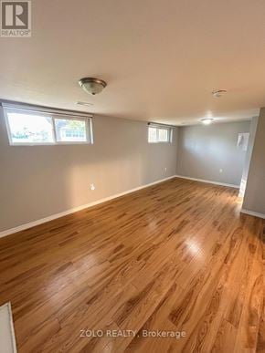 Kitchener apartment for rent - A room with wooden flooring and a window.