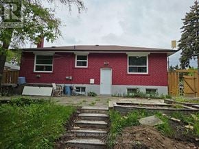 Toronto (Woburn) apartment for rent - A red brick house with a white door and windows.
