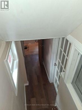 Toronto (Woburn) apartment for rent - A hallway with a wooden floor and white walls.