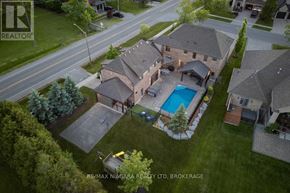 Niagara-On-The-Lake (St. Davids) apartment for rent - A large house with a pool in the backyard.