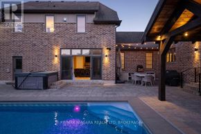 Niagara-On-The-Lake (St. Davids) apartment for rent - A house with a pool in the backyard.