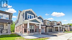 Kitchener apartment for rent - A row of houses with a realtor logo in the corner.