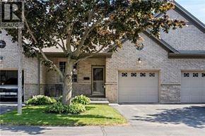 Port Dover townhouse for rent - A house with a tree in front of it.
