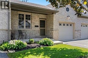Port Dover townhouse for rent - A house with a sign that says REALTOR in front of it.