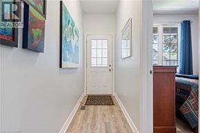 Port Dover townhouse for rent - A hallway with a white door and a brown doormat.