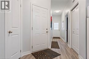 Port Dover townhouse for rent - A hallway with white doors and a brown doormat.