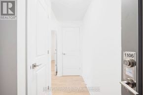 Mississauga (City Centre) condo for rent - A hallway with a door on the right and a door on the left.