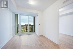 Mississauga (City Centre) condo for rent - A room with a view of the city through a large window.