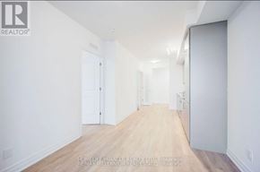 Mississauga (City Centre) condo for rent - A long hallway with white walls and wood floors.
