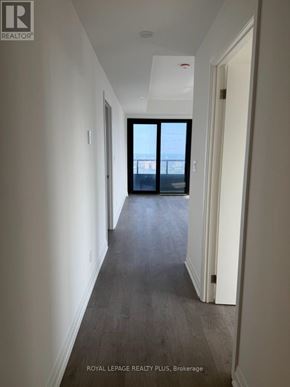 Mississauga (City Centre) condo for rent - A long hallway with a door at the end.