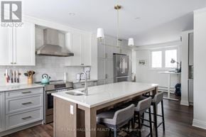 Ottawa apartment for rent - A kitchen with a table and chairs in the middle of it.