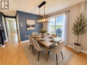 Barrie (Sunnidale) apartment for rent - A dining room with a wooden table and chairs.
