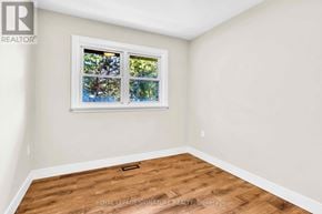 Newmarket (Gorham-College Manor) apartment for rent - A room with a window showing trees outside.