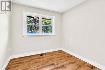 Newmarket (Gorham-College Manor) apartment for rent - A room with a window showing trees outside.